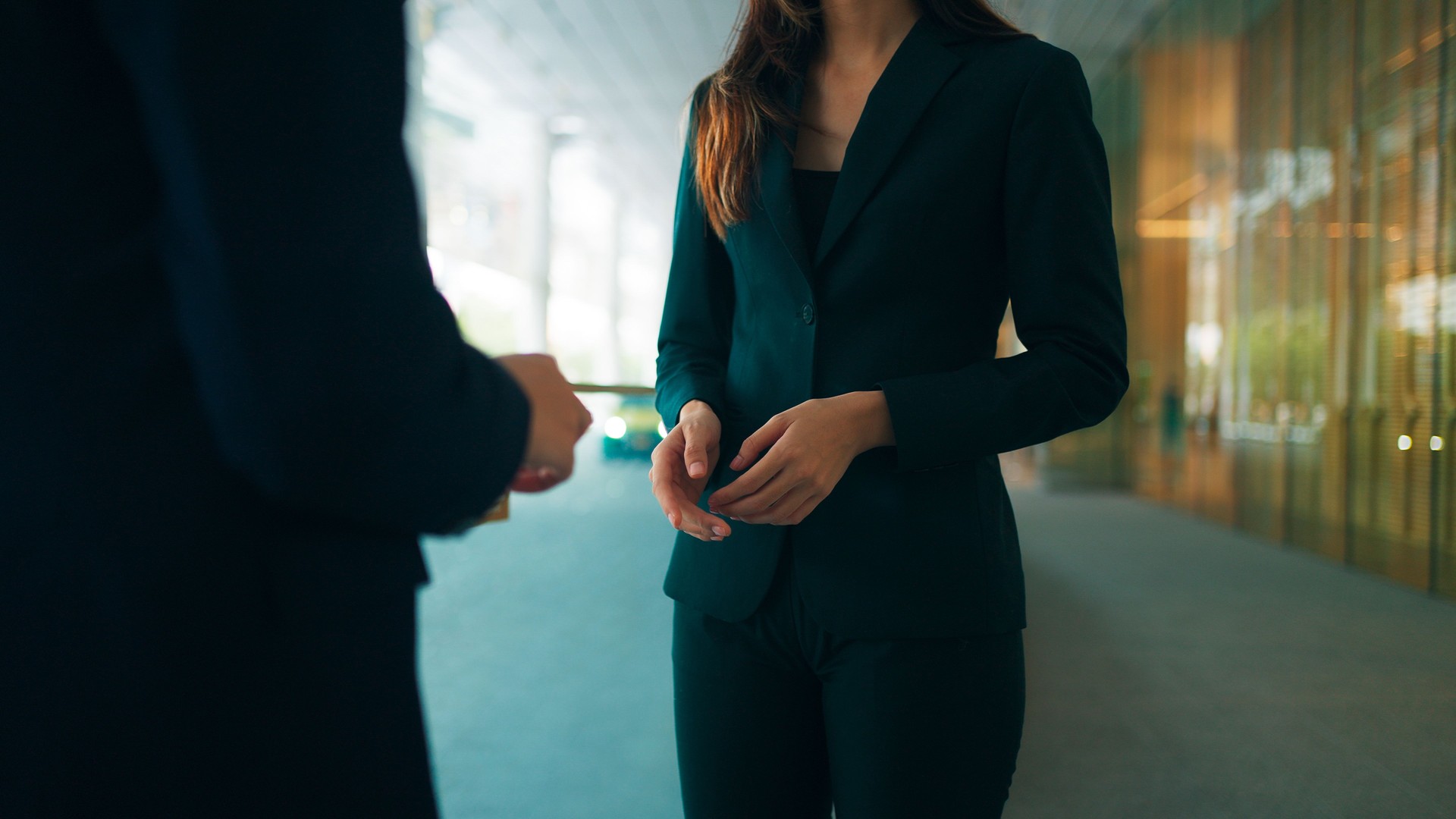 Close up shot of professional young Asian business people team beautiful female manager and handsome male co-worker in smart business attire working together, discussing business project plan in modern office building